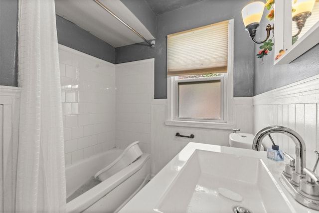 1111 N Franklin St, Dearborn, MI 48128 - bathroom featuring a sink, a wainscoted wall, toilet, and shower / bath combination with curtain