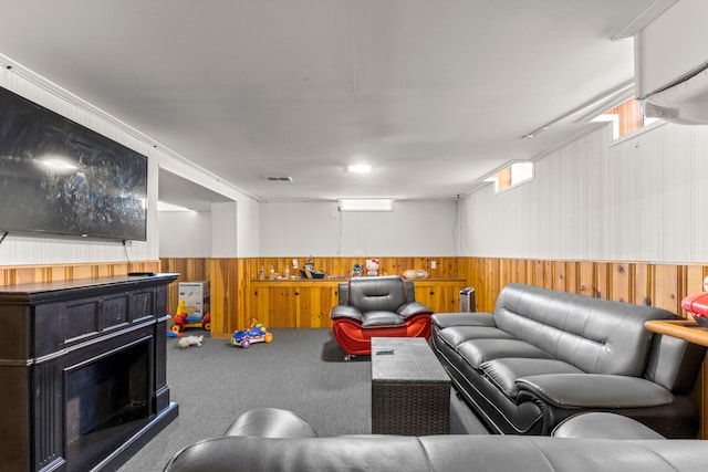 1111 N Franklin St, Dearborn, MI 48128 - carpeted living area featuring a fireplace, wood walls, visible vents, and a wainscoted wall