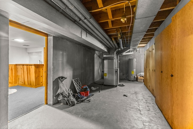 1111 N Franklin St, Dearborn, MI 48128 - unfinished below grade area with water heater, a wainscoted wall, and heating unit