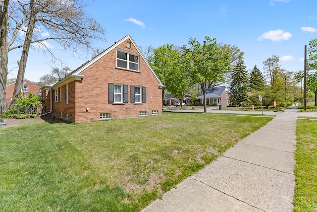 1111 N Franklin St, Dearborn, MI 48128 - view of side of home featuring a lawn and brick siding