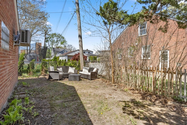 1111 N Franklin St, Dearborn, MI 48128 - view of yard featuring an outdoor hangout area, a fenced backyard, and central AC