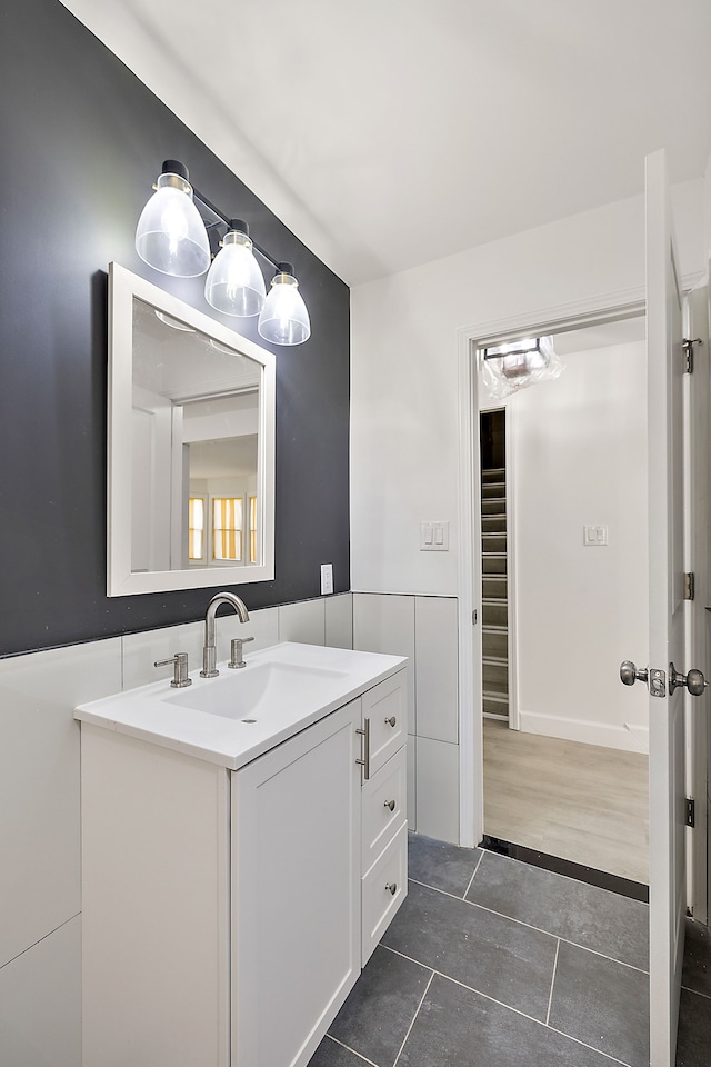 bathroom with tile patterned flooring and vanity