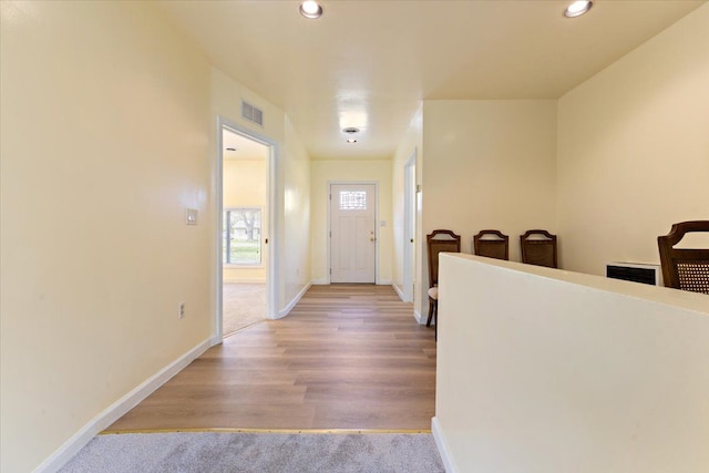 foyer entrance featuring recessed lighting, baseboards, and visible vents