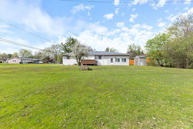 view of yard featuring an outbuilding and a storage unit