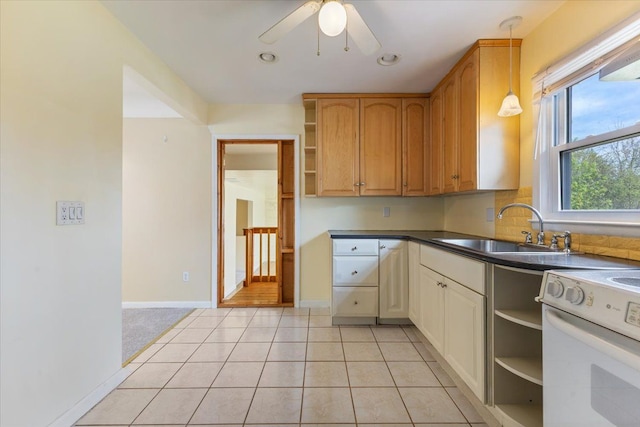kitchen featuring open shelves, electric range, a ceiling fan, dark countertops, and a sink