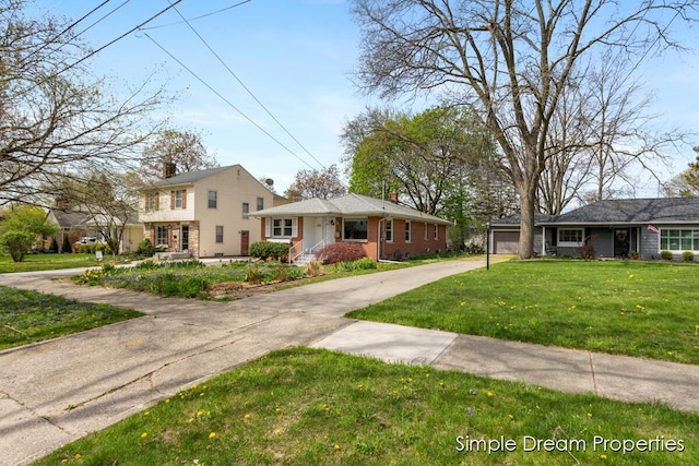 view of front of home featuring a garage, concrete driveway, and a front yard