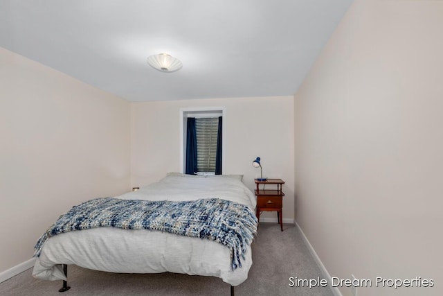 carpeted bedroom with baseboards