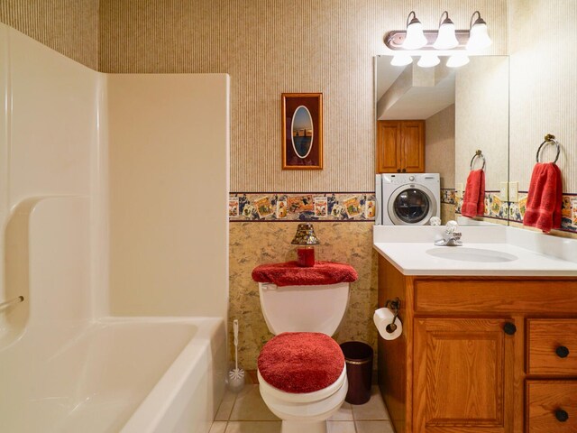 full bath featuring tile patterned flooring, vanity, washer / dryer, toilet, and wallpapered walls