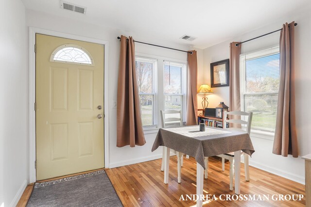 entrance foyer with baseboards, visible vents, and light wood-style floors