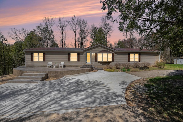 ranch-style house with metal roof