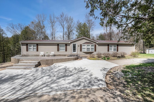 view of front of property featuring metal roof