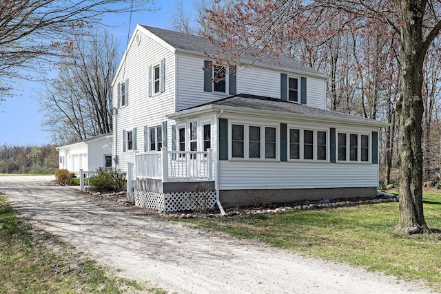traditional-style home with roof with shingles