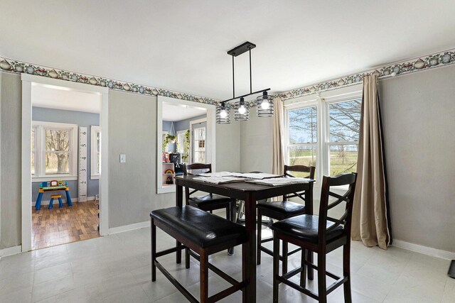 dining space with baseboards