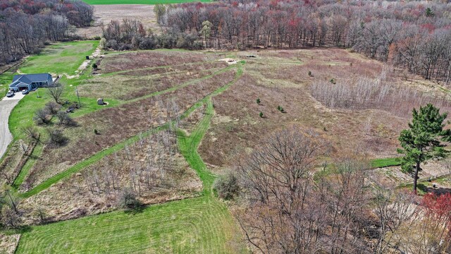 aerial view featuring a rural view and a forest view