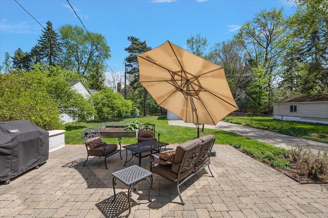 view of patio / terrace featuring an outdoor living space, fence, and grilling area
