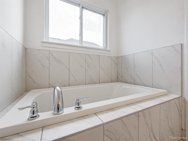 full bathroom with a bath