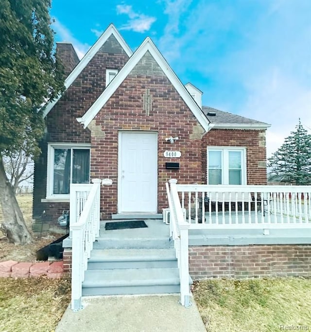 view of front of home featuring brick siding
