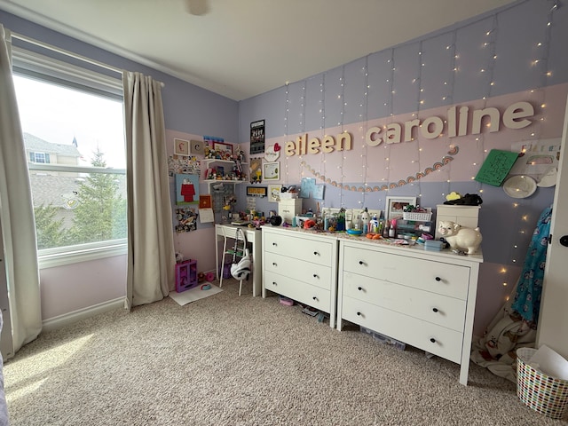 carpeted bedroom with baseboards and multiple windows