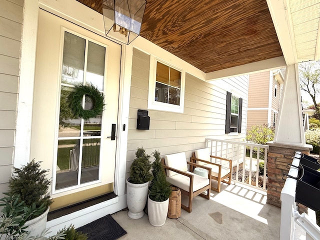 property entrance featuring covered porch