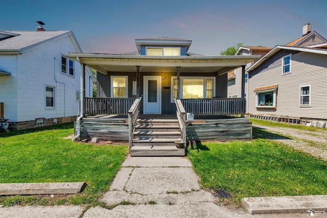 934 Smith St, Monroe, MI 48161 - bungalow-style home with covered porch and a front yard