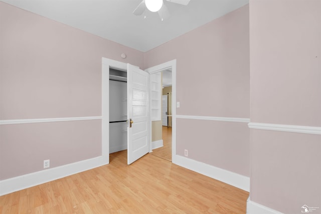 934 Smith St, Monroe, MI 48161 - unfurnished bedroom with baseboards, a closet, and wood finished floors
