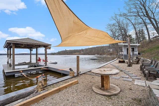 view of dock featuring a water view and boat lift