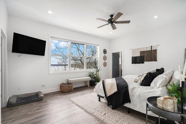 bedroom with baseboards, a ceiling fan, recessed lighting, and wood finished floors