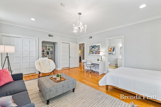 bedroom with crown molding, visible vents, wood finished floors, recessed lighting, and a chandelier