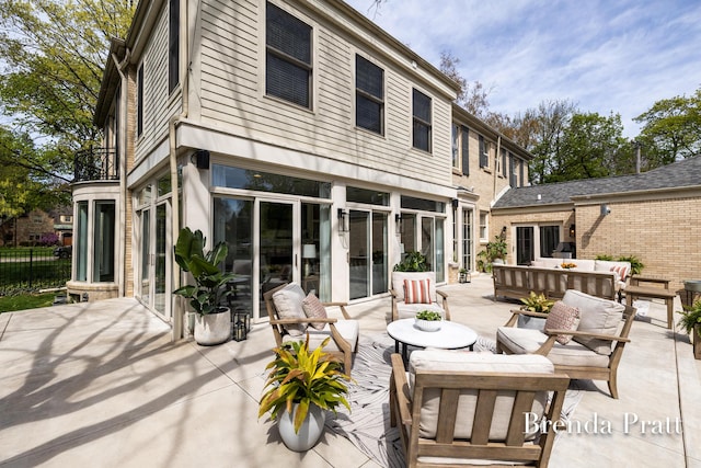 rear view of house featuring an outdoor hangout area