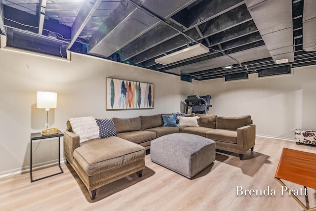 living room featuring baseboards and wood finished floors
