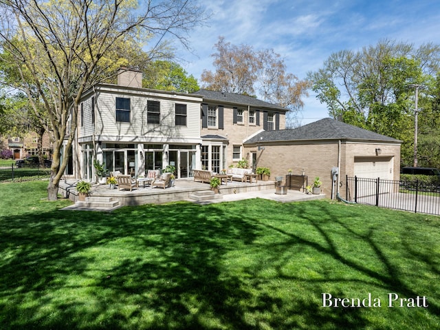 colonial inspired home with a garage, a front lawn, fence, a chimney, and an outdoor living space