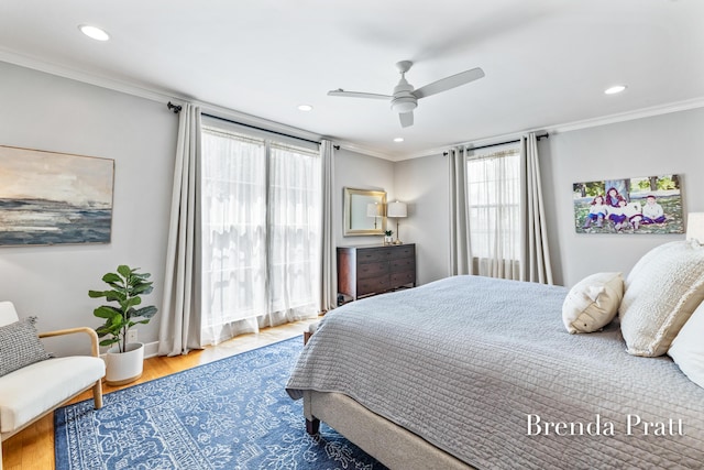 bedroom with crown molding, a ceiling fan, recessed lighting, and wood finished floors