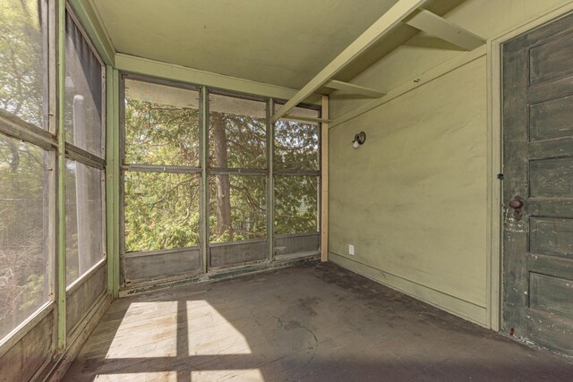 unfurnished sunroom featuring plenty of natural light