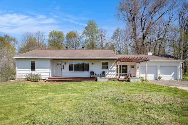 ranch-style home featuring a porch, a garage, a front lawn, and driveway
