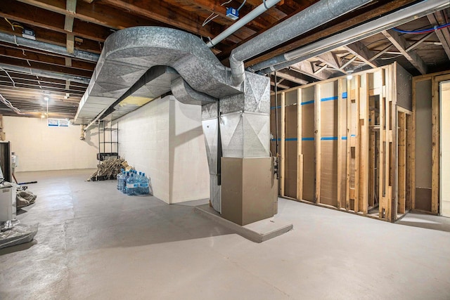 unfinished below grade area featuring heating unit