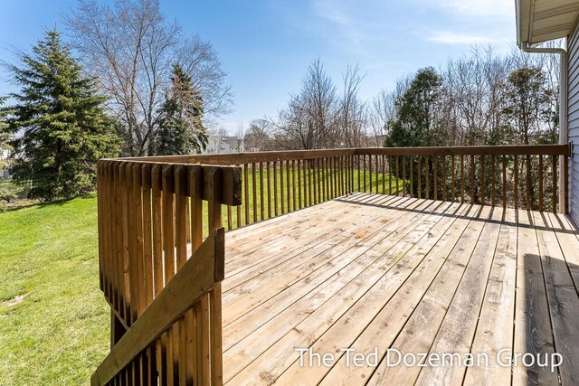 wooden terrace with a yard