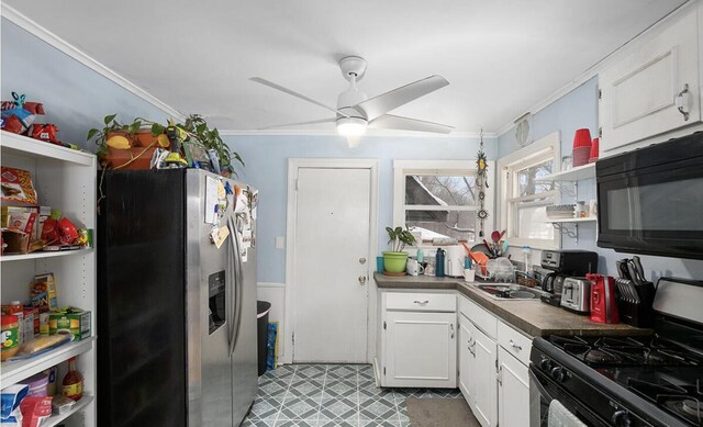 kitchen with crown molding, open shelves, black microwave, gas range oven, and stainless steel fridge with ice dispenser
