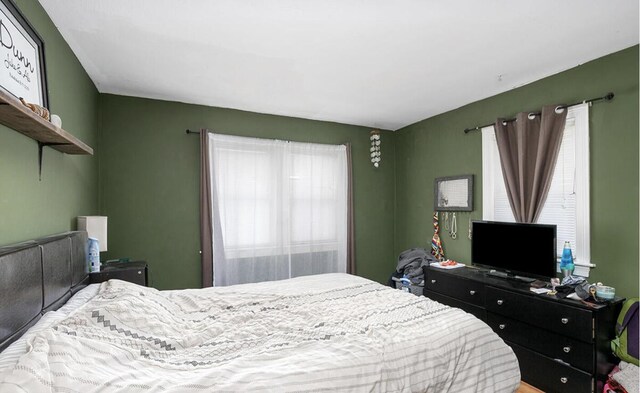 bedroom with multiple windows