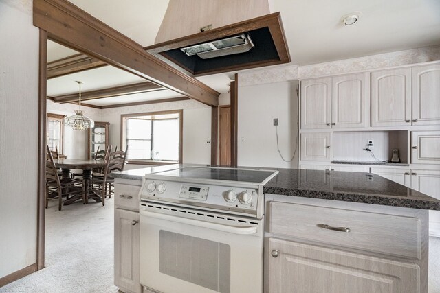 kitchen featuring light colored carpet, dark stone counters, white electric stove, a notable chandelier, and decorative light fixtures