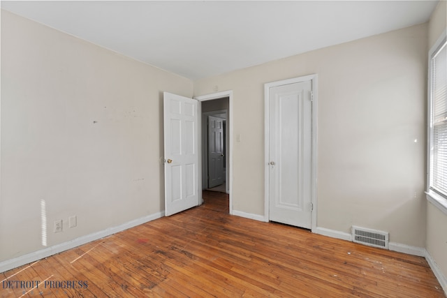 18626 Prevost St, Detroit, MI 48235 - unfurnished bedroom with visible vents, baseboards, and hardwood / wood-style floors