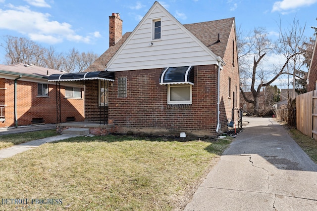 18626 Prevost St, Detroit, MI 48235 - exterior space featuring brick siding, fence, driveway, and a chimney