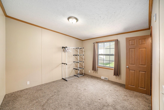 5355 W Remus Rd, Mount Pleasant, MI 48858 - carpeted empty room featuring visible vents, ornamental molding, a textured ceiling, and lofted ceiling