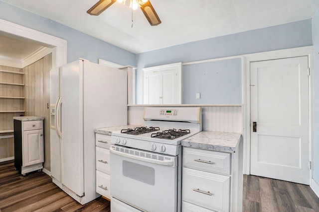 kitchen with white cabinets, dark wood-style flooring, a ceiling fan, and white appliances
