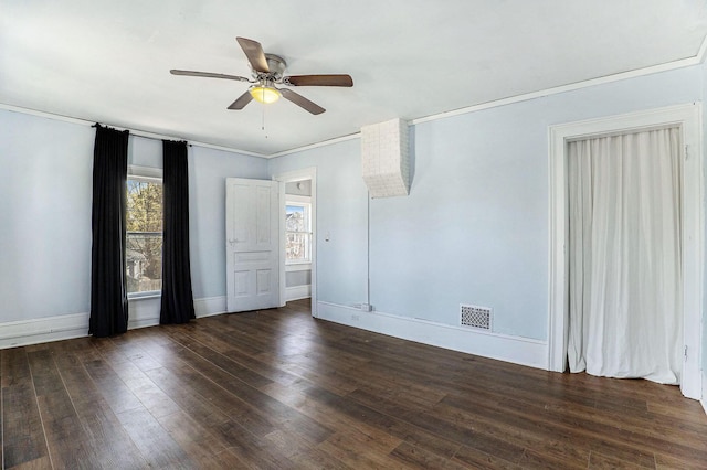 unfurnished room with a ceiling fan, visible vents, crown molding, baseboards, and hardwood / wood-style floors