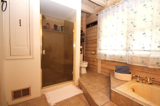 bathroom featuring tile patterned flooring, a shower stall, toilet, and visible vents