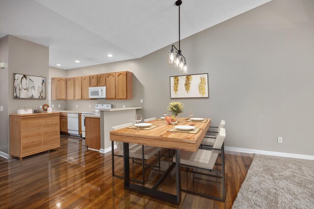 dining space with baseboards, recessed lighting, and dark wood-style floors