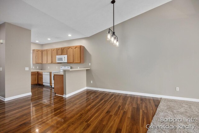 kitchen with white appliances, baseboards, dark wood-type flooring, light countertops, and recessed lighting