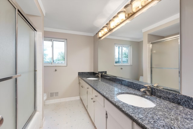 bathroom featuring toilet, visible vents, and a sink