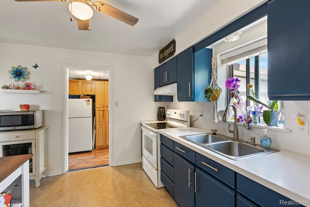 5304 E Frances Rd, Mount Morris, MI 48458 - kitchen with white appliances, blue cabinets, under cabinet range hood, and ceiling fan