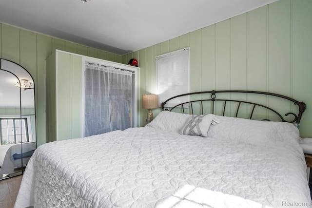 5304 E Frances Rd, Mount Morris, MI 48458 - bedroom with a decorative wall and wood finished floors